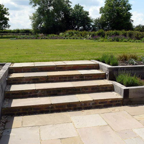 Contemporary Country Garden Steps from the terrace to the garden