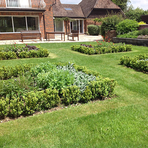 French style Garden Brick paver edged sandstone terrace