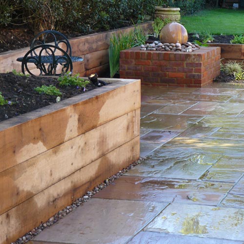 Oak Sleepers and Sandstone Paving