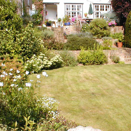 Shrubs soften the appearance of the bricks